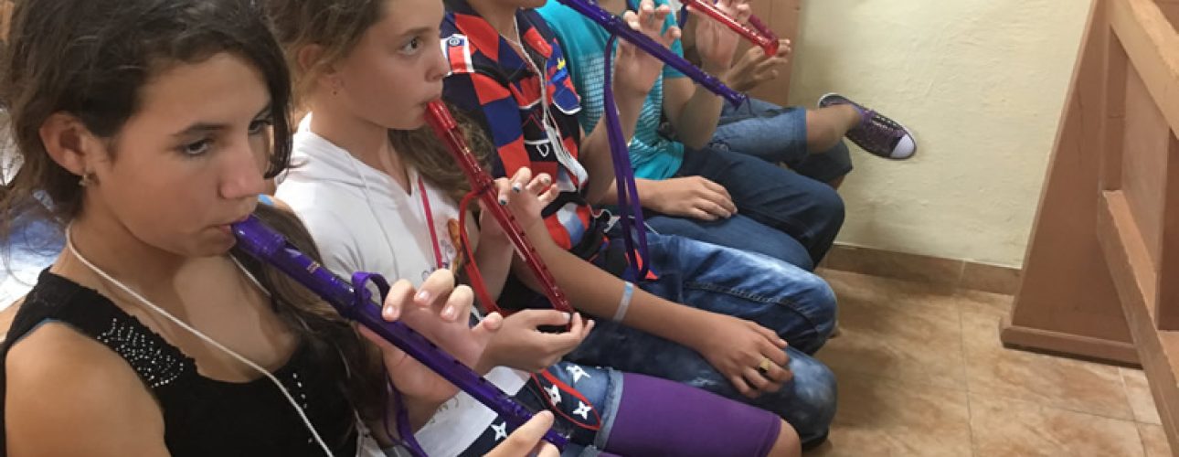 students playing recorder in school